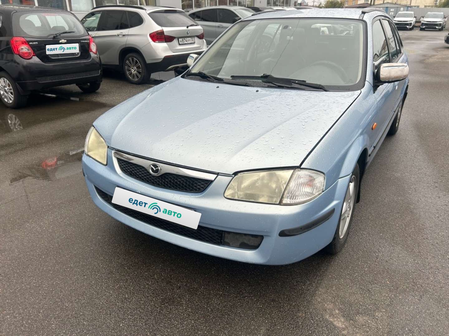 Mazda 323, 1999 — обложка